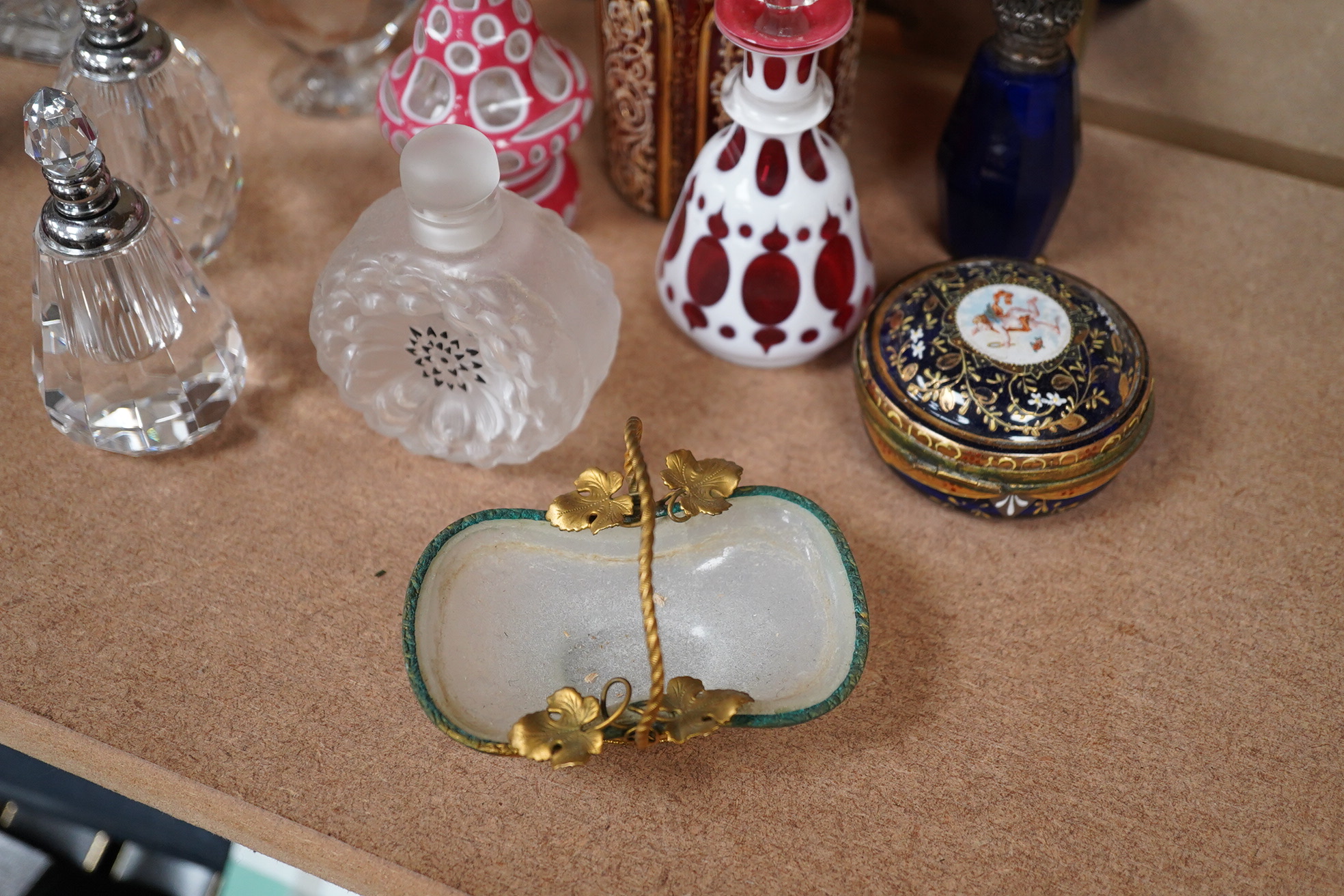 A collection of various glass scent bottles including a Lalique flower scent bottle and Bohemian examples, tallest 20.5cm. Condition - fair, some stoppers stuck